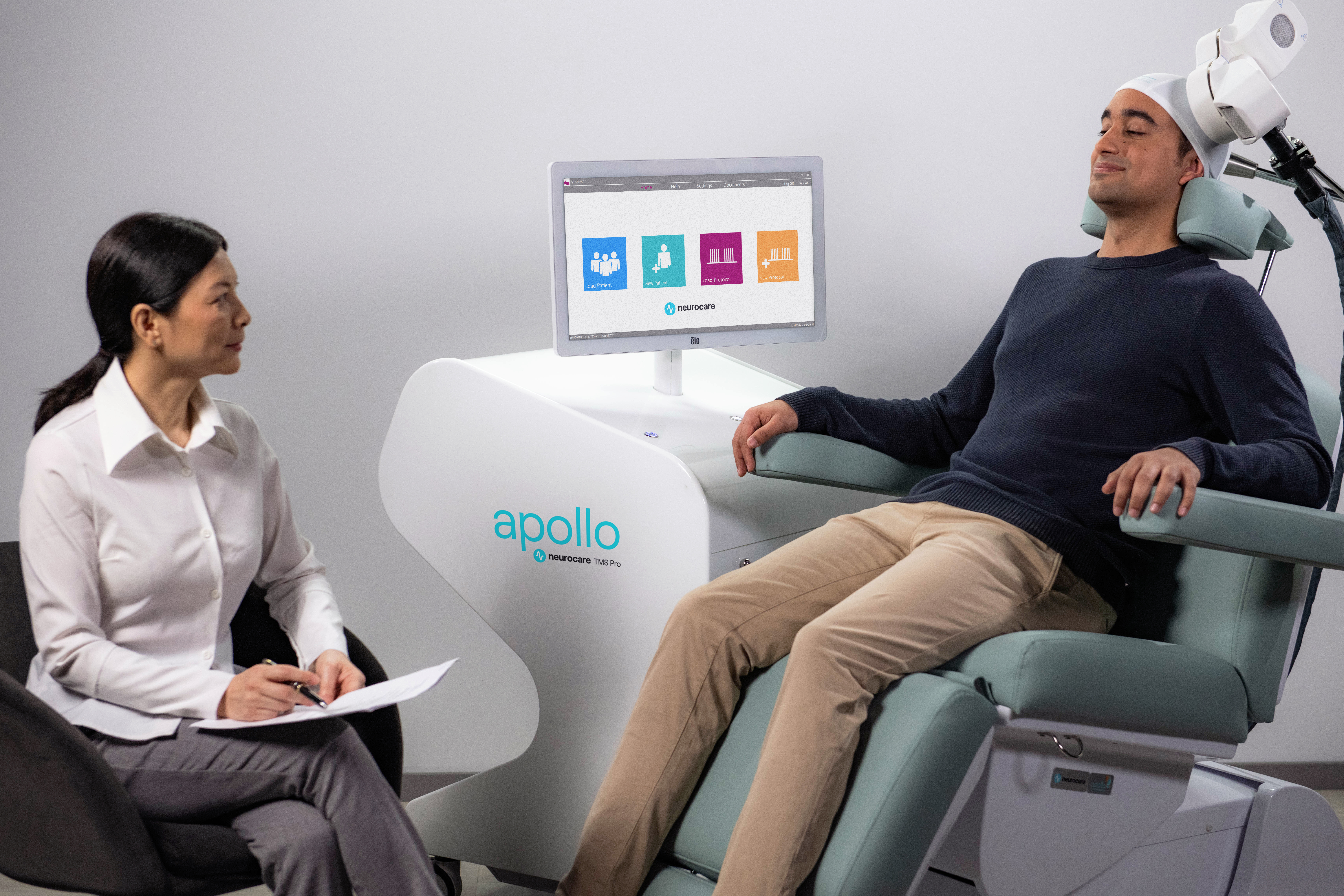 neurocare-TMS2966_Patient-Clinician-PsychotherapyXTMS_Apollo.jpg