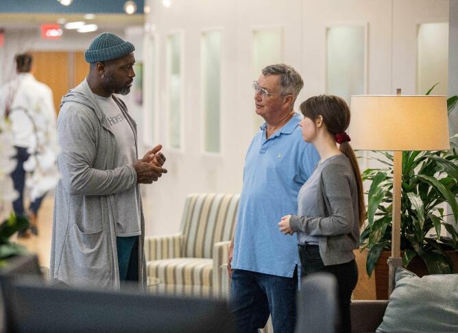 hopeway counselor talking to man and woman in lobby